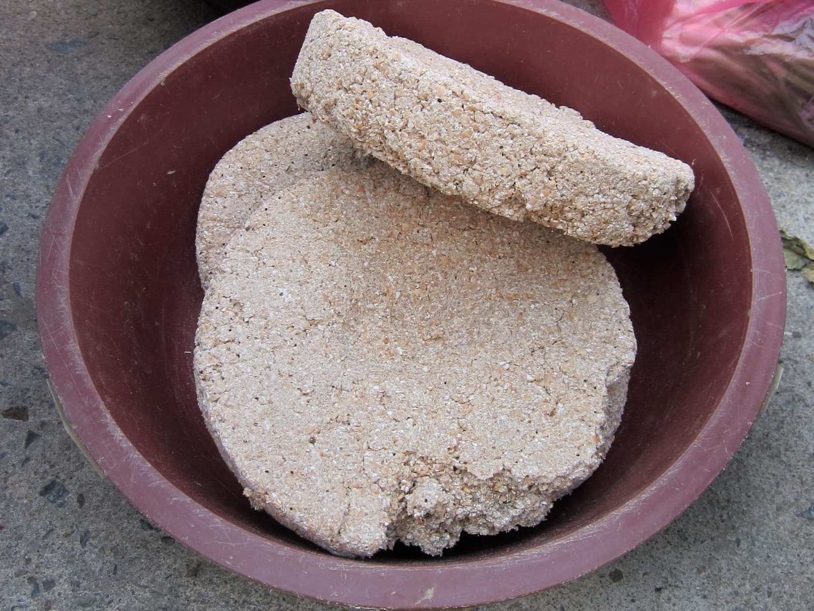 A round, dried fermentation starter cake, similar in form to marcha